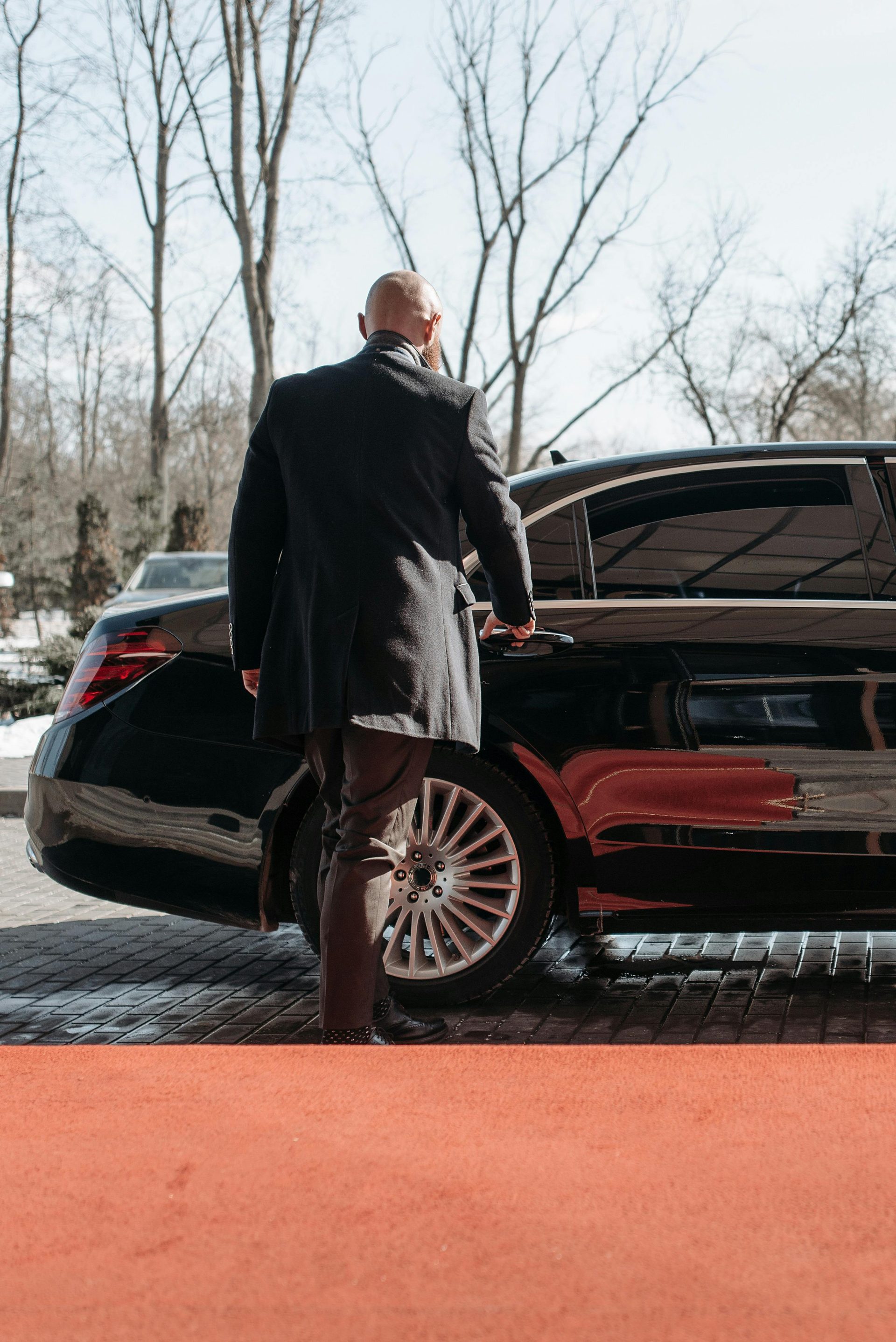 A Man Going Inside the Car